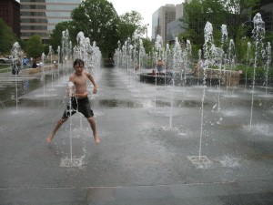 Kid playing in fountain